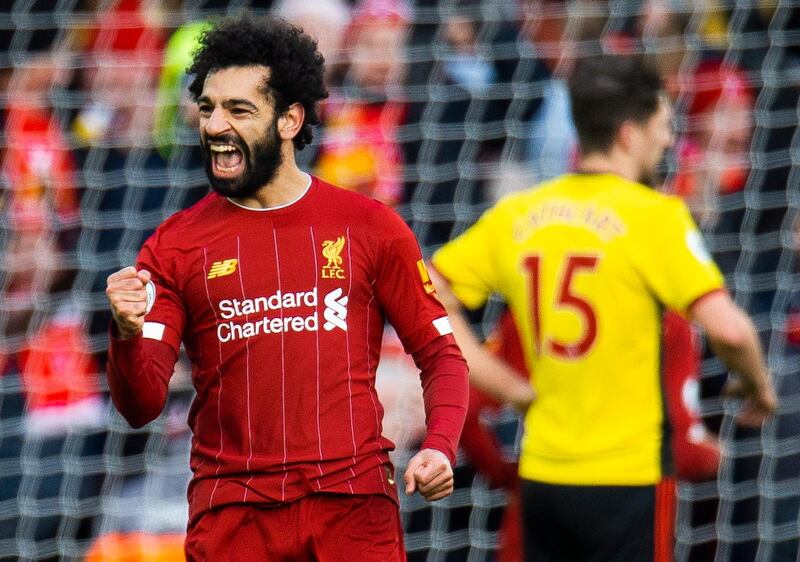 Liverpool's Mohamed Salah celebrates scoring the first goal in a 2-0 Premier League win against Watford. EPA