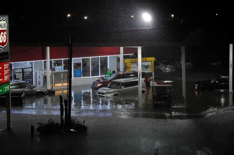 Cars sit abandoned at a flooded gas station after Hurricane Harvey made landfall on the Texas Gulf coast and brought heavy rain to the region, in Houston, Texas, U.S. August 26, 2017.  REUTERS/Nick Oxford