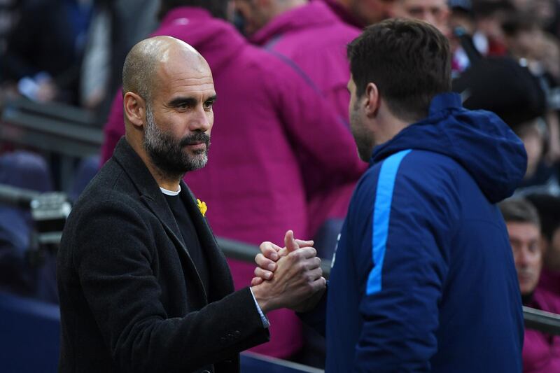 Manchester City manager Pep Guardiola, left, and Tottenham counterpart Mauricio Pochettino shake hands ahead of kick-off. Shaun Botterill / Getty Images