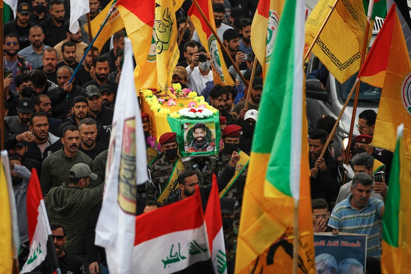 Iraqi mourners carry the coffin of Fadel Al Maksousi, a Kataib Hezbollah fighter, who was reportedly killed in the US strikes on Tuesday. AFP