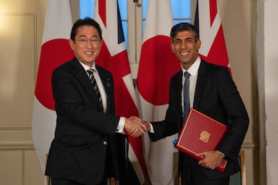Prime Minister Rishi Sunak and his Japanese counterpart Fumio Kishida shake hands after signing a UK-Japan defence agreement. PA