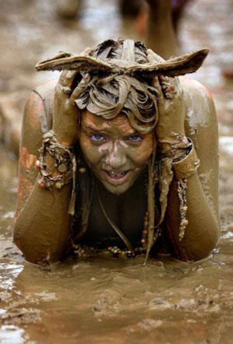 The Glastonbury Festival is renowned for its music and the inevitable downpour, which leaves some fans happily revelling in mud.