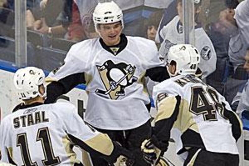 Chris Kunitz celebrates his first goal with Penguins teammates Jordan Staal and Tyler Kennedy.