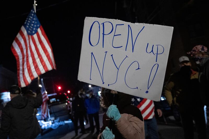 People protest outside of the Mac's Public House after closed it down amid the Covid-19 pandemic in the Staten Island borough of New York City. Reuters