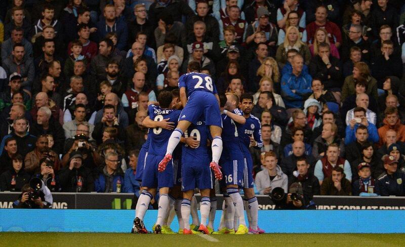Chelsea's Branislav Ivanovic is congratulated by his teammates after scoring the third goal for his team against Burnley. Peter Powell / EPA 
