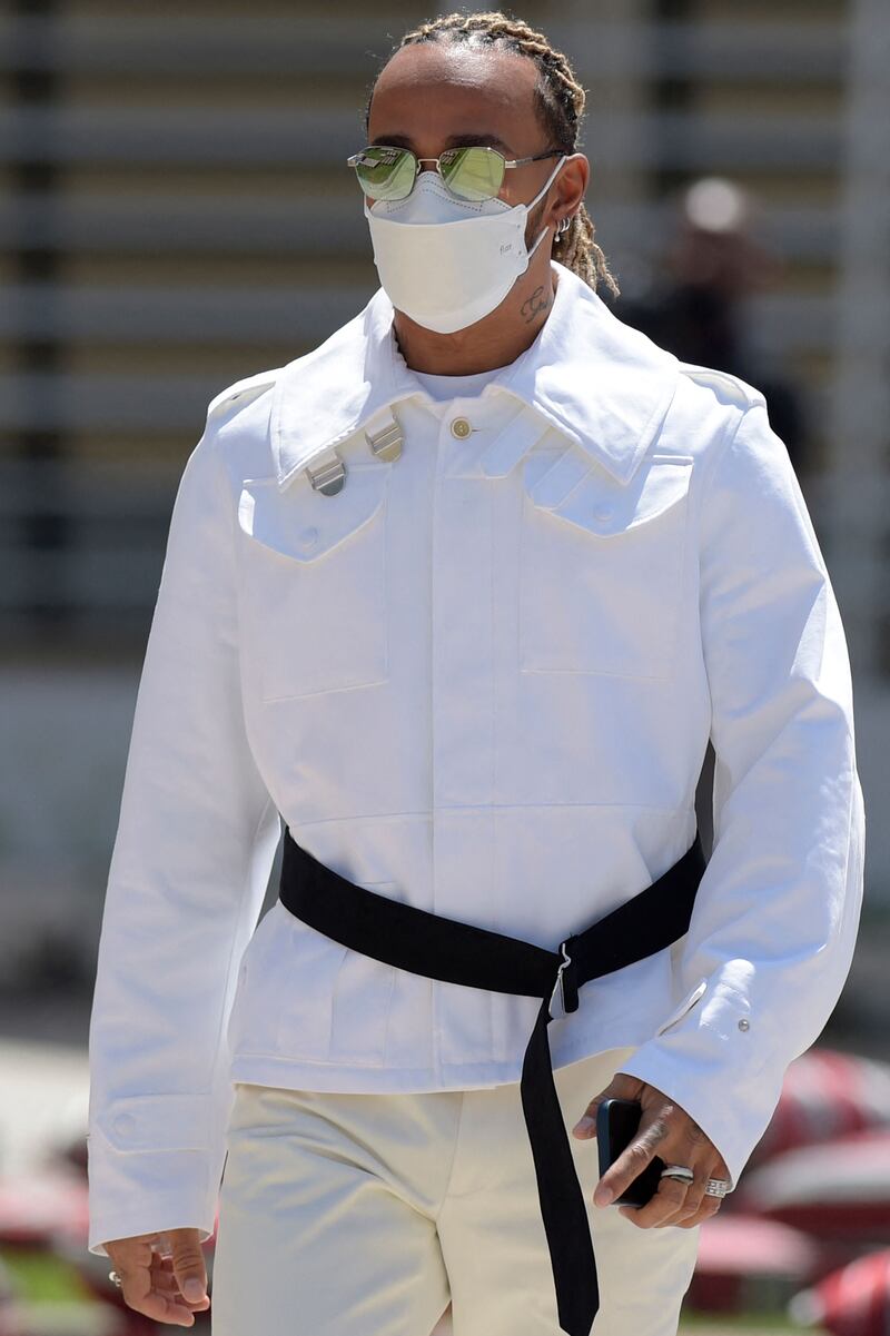 Lewis Hamilton, in a white Alexander McQueen jacket with cream trousers, ahead of the Bahrain Grand Prix at Bahrain International Circuit on March 18, 2022. Getty Images