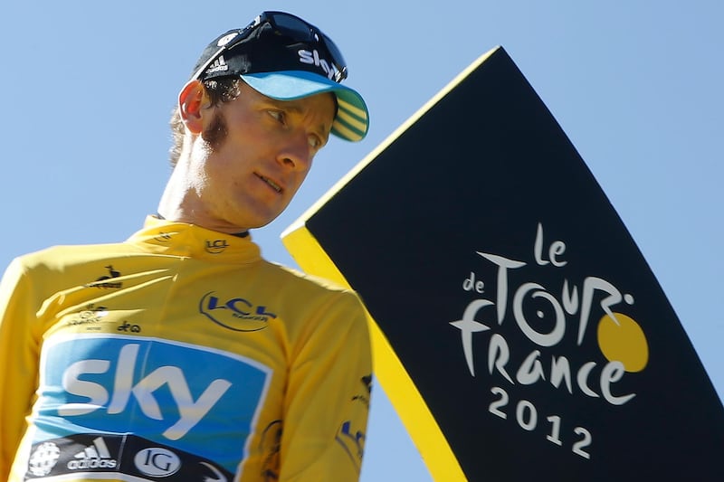 FILE - In this Sunday, July 22, 2012 file photo, Bradley Wiggins, winner of the 2012 Tour de France cycling race, stands on the podium in Paris, France. A British parliamentary committee says in a doping investigation report that Bradley Wiggins used a banned powerful corticosteroid to enhance his performance and not for medical reasons while winning the Tour de France in 2012. The report accuses Team Sky of crossing an â€œethical lineâ€ after preaching zero tolerance. Team Sky criticized â€œthe anonymous and potentially malicious claimâ€ by members of parliament. (AP Photo/Laurent Cipriani, File)