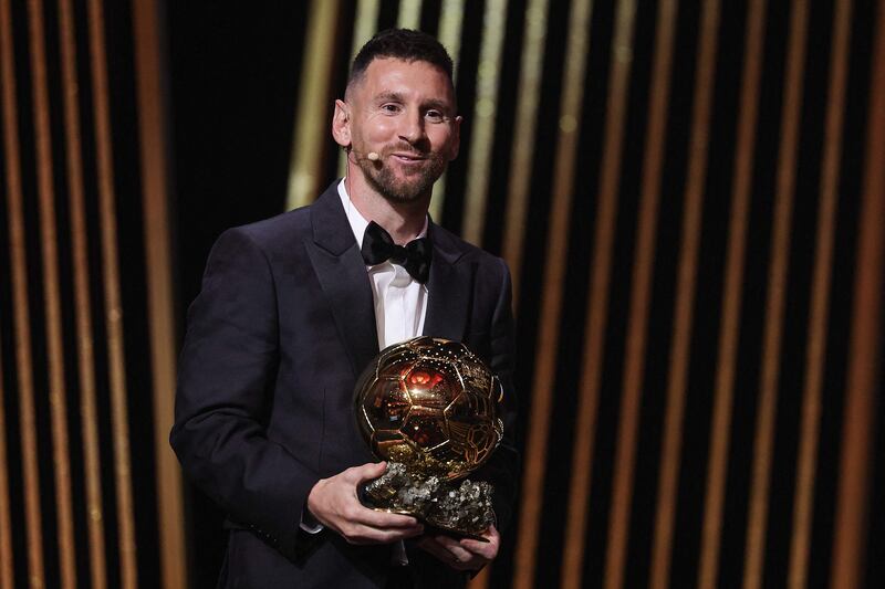 Inter Miami and Argentina forward Lionel Messi on stage with his trophy as he receives the Ballon d'Or award. AFP