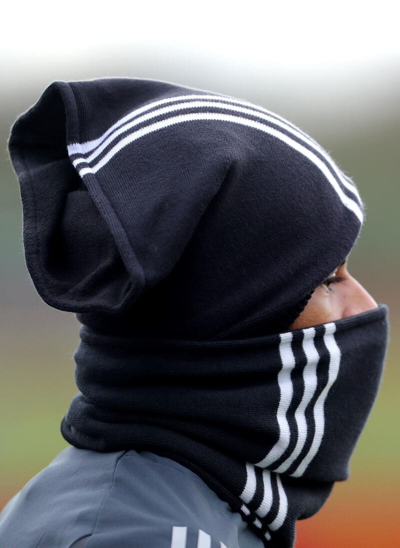 Manchester United's Marcus Rashford keeps himself warm during training ahead of United's Europa League match against AZ Alkmaar.