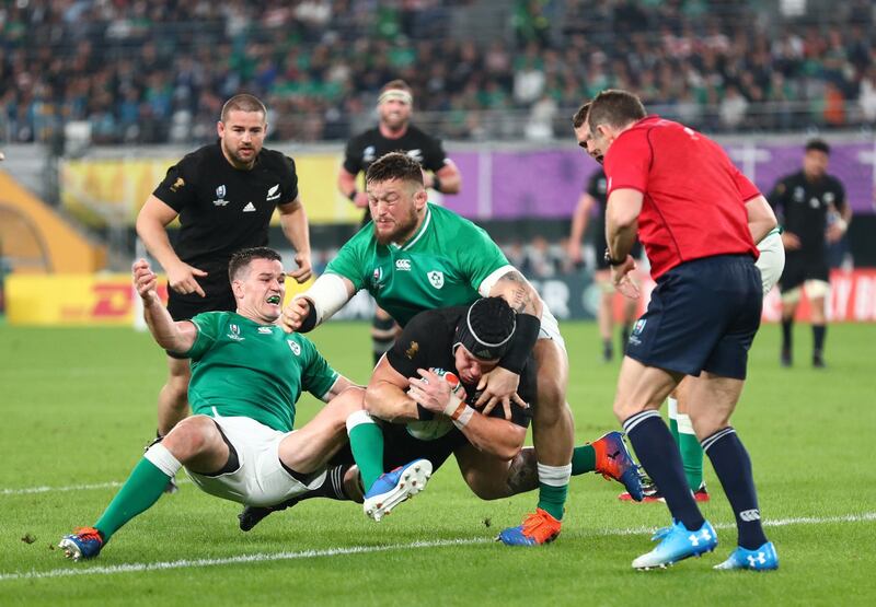 Matt Todd of New Zealand scores his team's fifth try past Andrew Porter (R) and Johnny Sexton of Ireland during the Rugby World Cup 2019 Quarter Final match between New Zealand and Ireland at the Tokyo Stadium in Chofu, Tokyo, Japan. Getty Images