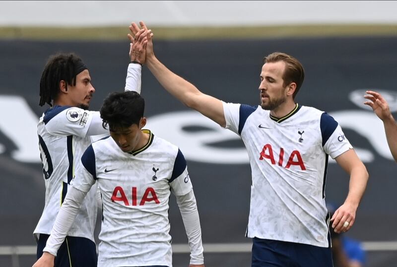 Tottenham's Harry Kane, right, celebrates after scoring his side's opening goal. AP