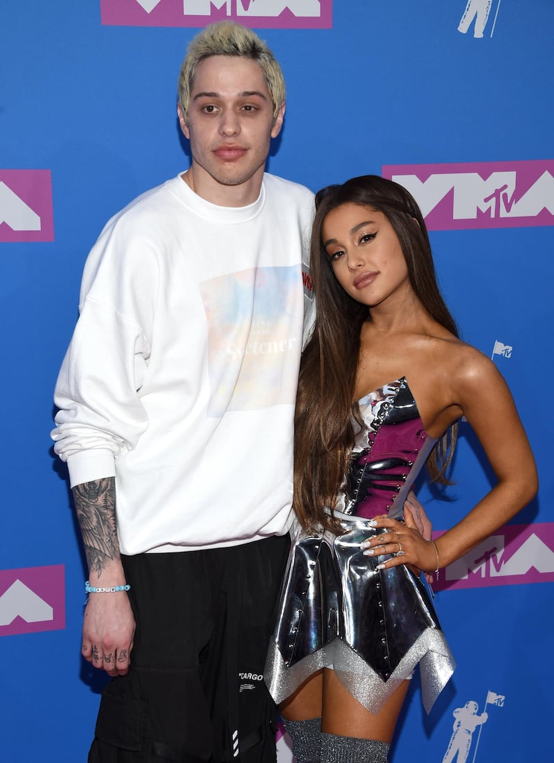 FILE- In this Aug. 20, 2018, file photo Pete Davidson, left, and Ariana Grande arrive at the MTV Video Music Awards at Radio City Music Hall in New York. Grande has released a song referencing her exes, including former fiance and â€œSNLâ€ star Davidson and the late Mac Miller. (Photo by Evan Agostini/Invision/AP, File)