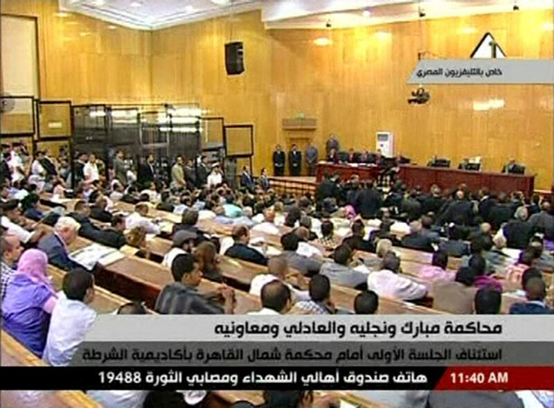 This video image taken from Egyptian State Television shows  a  general view inside the Cairo courtroom Wednesday Aug. 3, 2011, where ailing, 83-year-old Hosni Mubarak  two of his sons and other officials are on trial on charges of corruption and ordering the killing of protesters during the uprising that ousted him. The scene, shown live on Egypt's state TV, was Egyptians' first look at their former president since Feb. 10, the day before his fall when he gave a defiant speech refusing to resign.   (AP Photo/Egyptian State TV)   EGYPT OUT *** Local Caption ***  Egypt Mubarak Trial.JPEG-07490.jpg