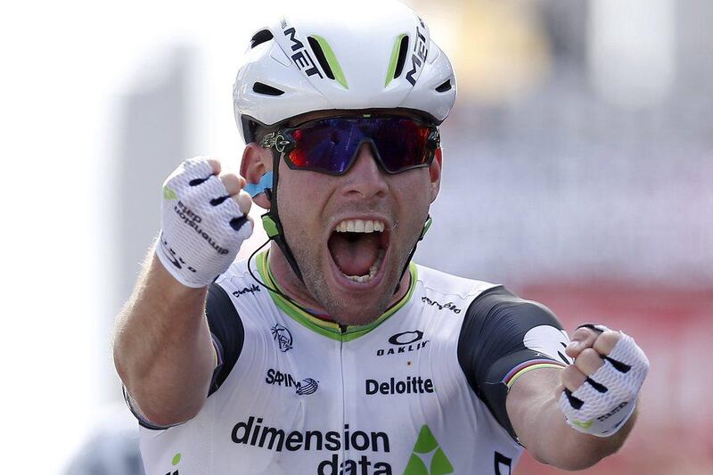 Team Dimension Data rider Mark Cavendish celebrates after winning the first stage of the 103rd Tour de France on Saturday at Utah Beach. Yoan Valat / EPA / July 2, 2016 