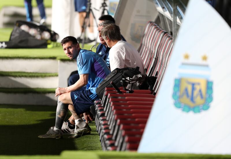 Argentina's Lionel Messi in the dugout at Al Nahyan Stadium in Abu Dhabi.