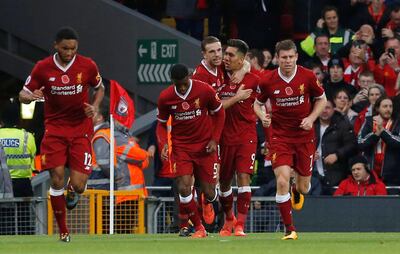 Soccer Football - Premier League - Liverpool vs Huddersfield Town - Anfield, Liverpool, Britain - October 28, 2017   Liverpool's Roberto Firmino celebrates scoring their second goal with Jordan Henderson and team mates   Action Images via Reuters/Craig Brough    EDITORIAL USE ONLY. No use with unauthorized audio, video, data, fixture lists, club/league logos or "live" services. Online in-match use limited to 75 images, no video emulation. No use in betting, games or single club/league/player publications. Please contact your account representative for further details.?