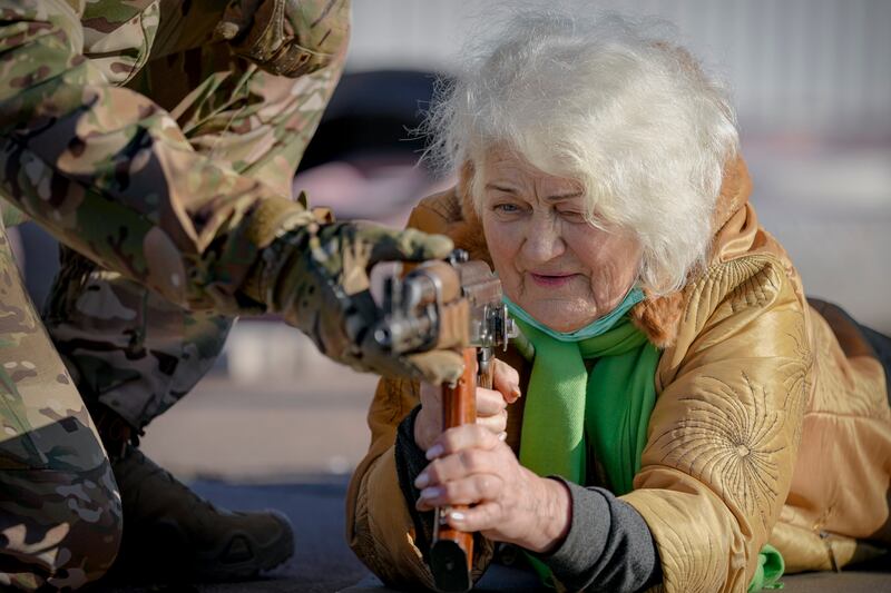 Valentyna Konstantynovska, 79, is taught to use a weapon during training for civilians, organised by the Azov Special Forces Unit of Ukraine's National Guard, in Donetsk.  AP