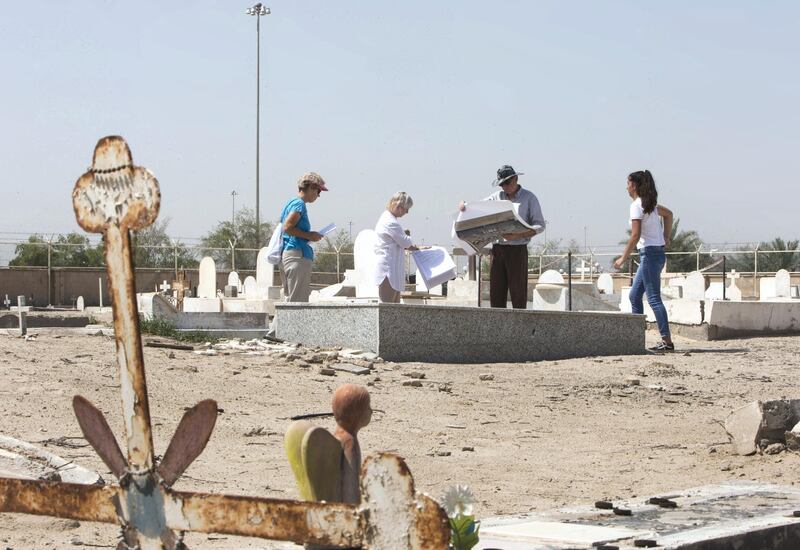 ABU DHABI, UNITED ARAB EMIRATES - Prof. Athol Yates of Khalifa University with his team at Sas Al Nakhel Cemetery, Non Muslim.  Ruel Pableo for The National for John Dennehy's story