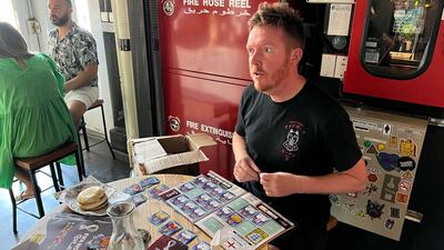 Chris Huntley, who began collecting World Cup stickers 32 years ago for Italia 90, hosts regular swap shops at Nightjar coffee shop in Alserkal Avenue. Photo: Simon Smedley