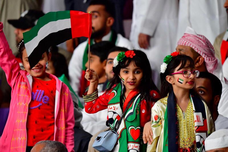 Young Emirati fans cheer during the 2019 AFC Asian Cup quarter-final football match between UAE and Australia at Hazza bin Zayed Stadium in Al Ain. AFP