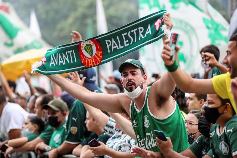Fans of Brazilian soccer club Palmeiras cheer as the team bus exits the training center in Sao Paulo, Brazil, 02 February 2022.  The team heads for the FIFA Club World Cup to be held from 03 through 12 February in the United Arab Emirates.   EPA / Sebastiao Moreira