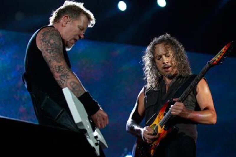 James Hetfield, lead vocalist, and Kirk Lee Hammett (R) of heavy metal band Metallica, perform at their World Magnetic tour concert in Abu Dhabi October 25, 2011. Reuters