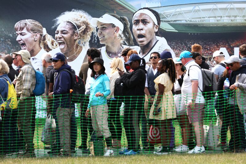 Spectators queue in Wimbledon Park ahead of day one of the tournament. Getty Images