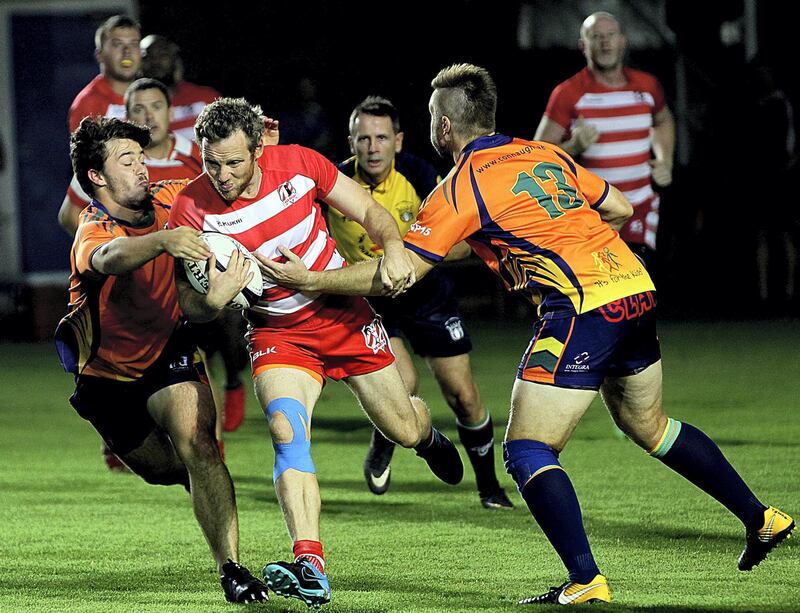 Sharjah, June, 01, 2018: RAK Rugby ( Red& White ) and  Arabian Knights ( Orange&BlacK) in action during the Nick Young Memorial match at the Sharjah Wanderers sports club in Sharjah . Satish Kumar for the National / Story by Paul Radley