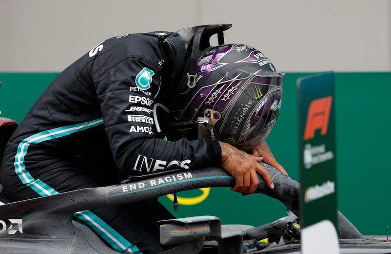 Mercedes driver Lewis Hamilton celebrates after winning the Turkish GP at the Istanbul Park circuit racetrack on Sunday. AP