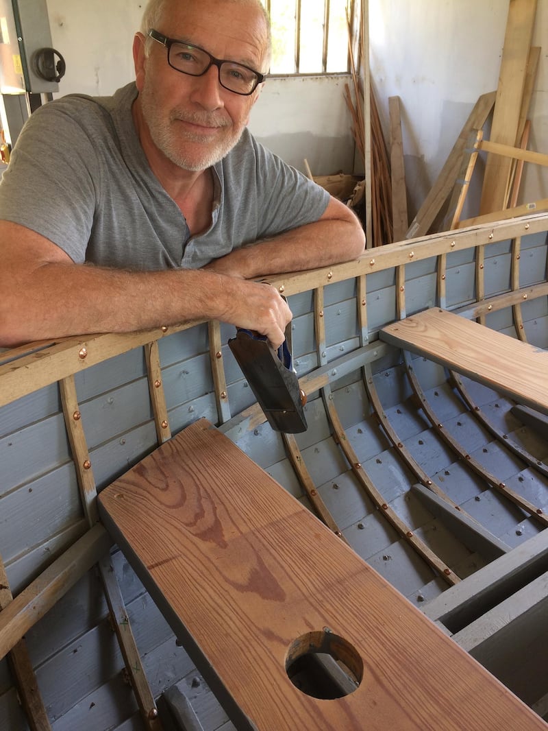 Jonathan Gornall with his almost finished boat. Jonathan Gornall