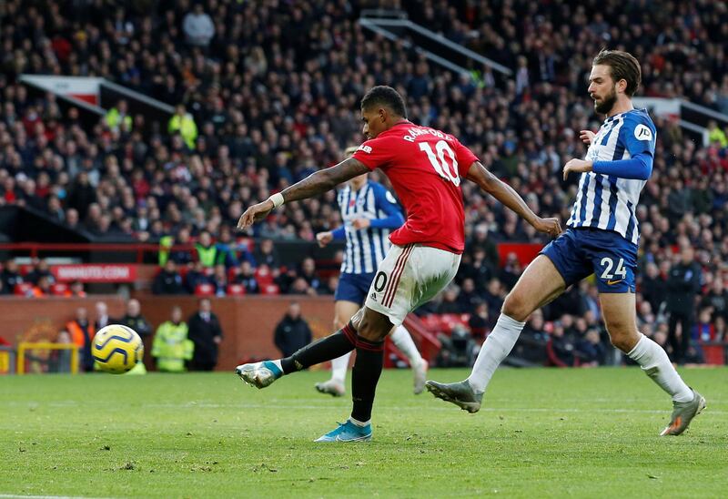 Manchester United's Marcus Rashford scores their third goal. Reuters