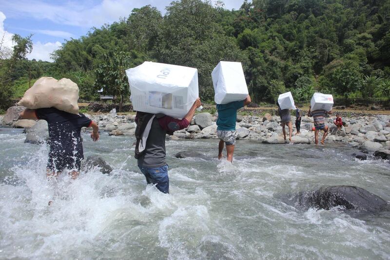 Indonesian workers transport ballot boxes for the upcoming general elections at the Bonto Matinggi village, Maros, South Sulawesi. Ballot boxes have been sent by elephant in Sumatra as voters prepare for one of the world's biggest one-day polls across a vast archipelago of 260 million.