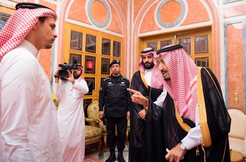 In this photo released by Saudi Press Agency, SPA, Saudi King Salman, right, points to Salah, a son, of Jamal Khashoggi as Crown Prince Mohammed bin Salman, second right, looks on, in Riyadh, Saudi Arabia, Tuesday, Oct. 23, 2018. Saudi Arabia, which for weeks maintained that Jamal Khashoggi had left the Istanbul consulate, on Saturday acknowledged he was killed there in a "fistfight." (Saudi Press Agency via AP)