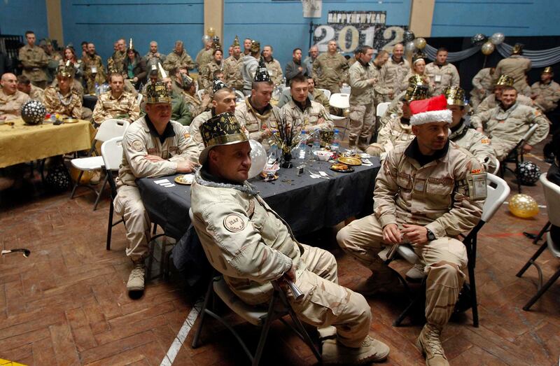 NATO troops from the U.S.-led International Security Assistance Force (ISAF) celebrate New Year's Eve in Kabul December 31, 2011. REUTERS/Omar Sobhani (AFGHANISTAN - Tags: MILITARY ANNIVERSARY) *** Local Caption ***  KAB113_AFGHANISTAN-_1231_11.JPG