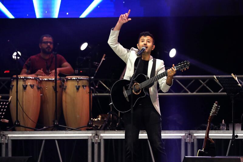 Egyptian singer Hamzeh Namera performs during a concert in the West Bank city of Hebron.  EPA