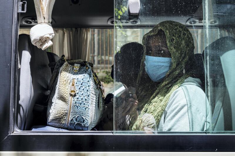 Women wait in the bus to be transported to shelters, where they will stay until Beirut’s airport reopens. Finbar Anderson for The National
