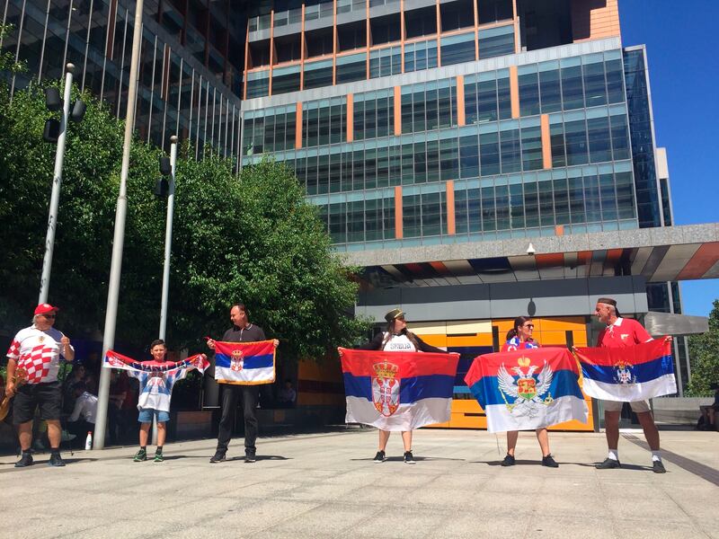 Supporters of Serbian tennis player Novak Djokovic hold their flags outside the Federal Court building in Melbourne. AP Photo