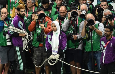 Photographers stand behind a rope during a Qatar World Cup match in Al Khor this month. AFP