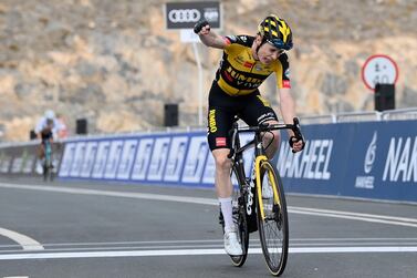 Denmark's Jonas Vingegaard celebrates as he crosses the finish line to win the fifth stage of the UAE tour cycling race, from Fujairah Intl Marine Club to Jebel Jais, in Abu Dhabi, United Arab Emirates, Thursday, Feb. 25, 2021. (Fabio Ferrari/LaPresse via AP)