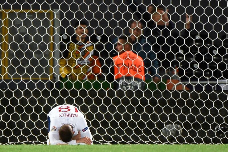 England's Ross Barkley reacts after Netherlands' third goal. AFP