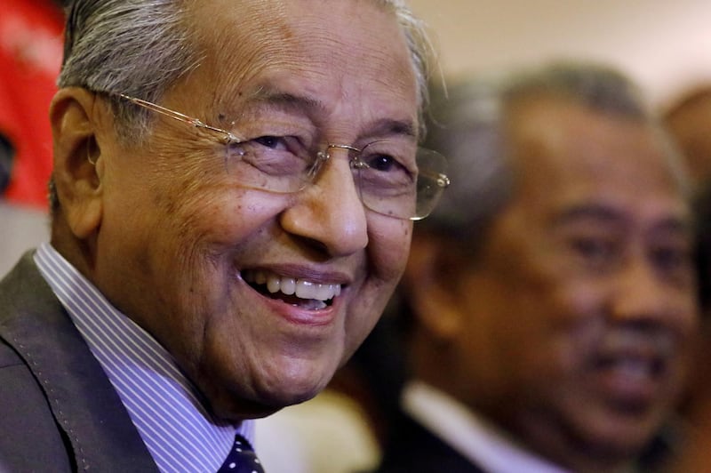 FILE PHOTO: Malaysia's Prime Minister Mahathir Mohamad reacts during a news conference in Putrajaya, Malaysia, July 15, 2019. REUTERS/Lim Huey Teng/File Photo