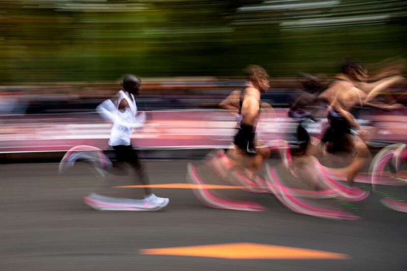 Eliud Kipchoge (L, in white), Kenyan marathon world record holder, in action next to his pacemakers during the INEOS 1:59 Challenge in Vienna, Austria. Kipchoge attempts to beat his own record becoming the first human to run a marathon in under two hours.  EPA