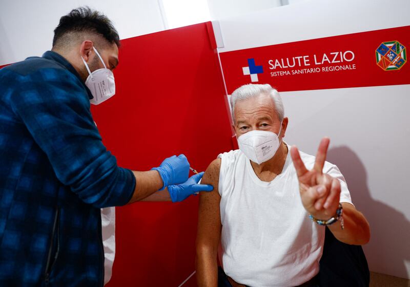 A man receives a dose of a Covid-19 vaccine at a Red Cross centre in Rome. Reuters