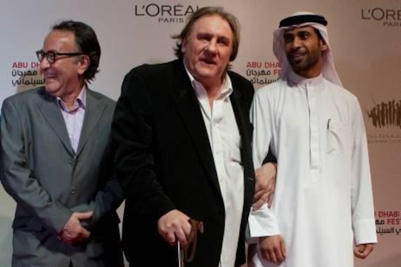 October 17, 2010, Abu Dhabi, UAE:

Left to right: Peter Scarlett, the Director of ADFF, Gerard Depardieu, and Eisa, on the red carpet, walking into the screening of Mr. Depardieu's latest film, Potiche.


Lee Hoagland/ The National
 
