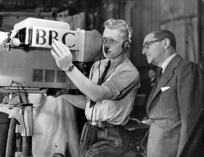 A BBC cameraman in 1946 explains the technicalities of the television camera to Russian-born US composer Irving Berlin before a programme about the composer.  Getty Images