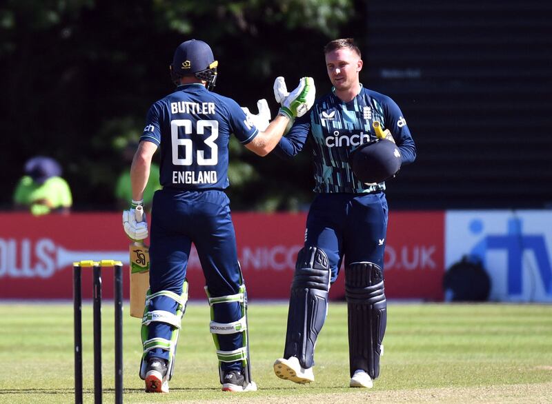 Cricket - Third One Day International - Netherlands v England - VRA Cricket Amsterdam, Amstelveen, Netherlands - June 22, 2022 England's Jason Roy and Jos Buttler celebrate at the end of the match REUTERS / Piroschka Van De Wouw