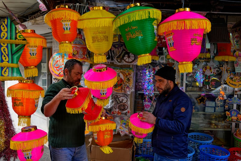People shop for decorations for the Muslim holy month of Ramadan at a shop in Beirut, Lebanon. AP