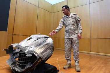 Saudi-led coalition spokesman, Colonel Turki Al Malki, displays the debris of a ballistic missile launched by Yemen's Houthi rebels towards the capital Riyadh during a news conference in Riyadh on March 29, 2020. Reuters 