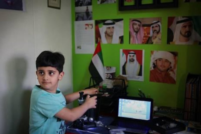 United Arab Emirates - Dubai - December 28, 2010.

NATIONAL: Adeeb Sulaiman Albelooshi (cq-al), 6, poses for his portrait at his home in Dubai on Tuesday, December 28, 2010. Albelooshi (Desk, this spelling is according to and written by his mother.) is an avid fan of science and is reading and studying several grades above his level. He is preparing for the Sheikh Hamdan Award for Academic Excellence. Amy Leang/The National
