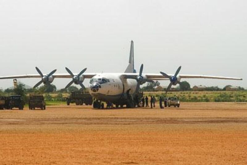 A sometimes murky past: This photograph purports to show an An-12 delivering military supplies to western Darfur in July 2007, defying a UN embargo.
